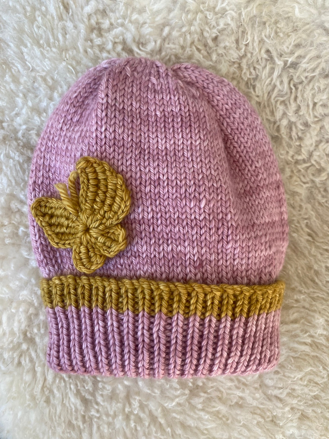 pink baby beanie with crochet butterfly