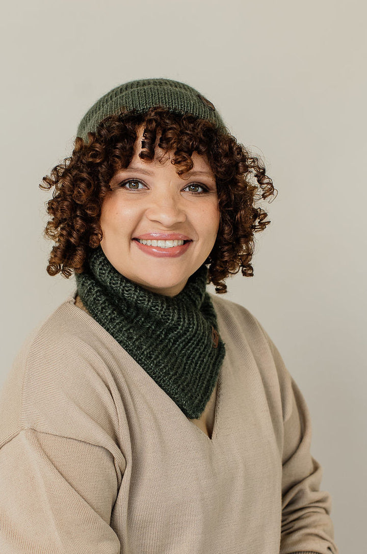 girl wearing moss green beanie and neck warmer