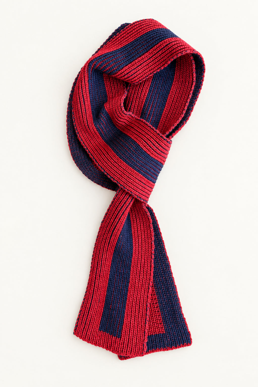 Red and navy striped scarf folded against plain background