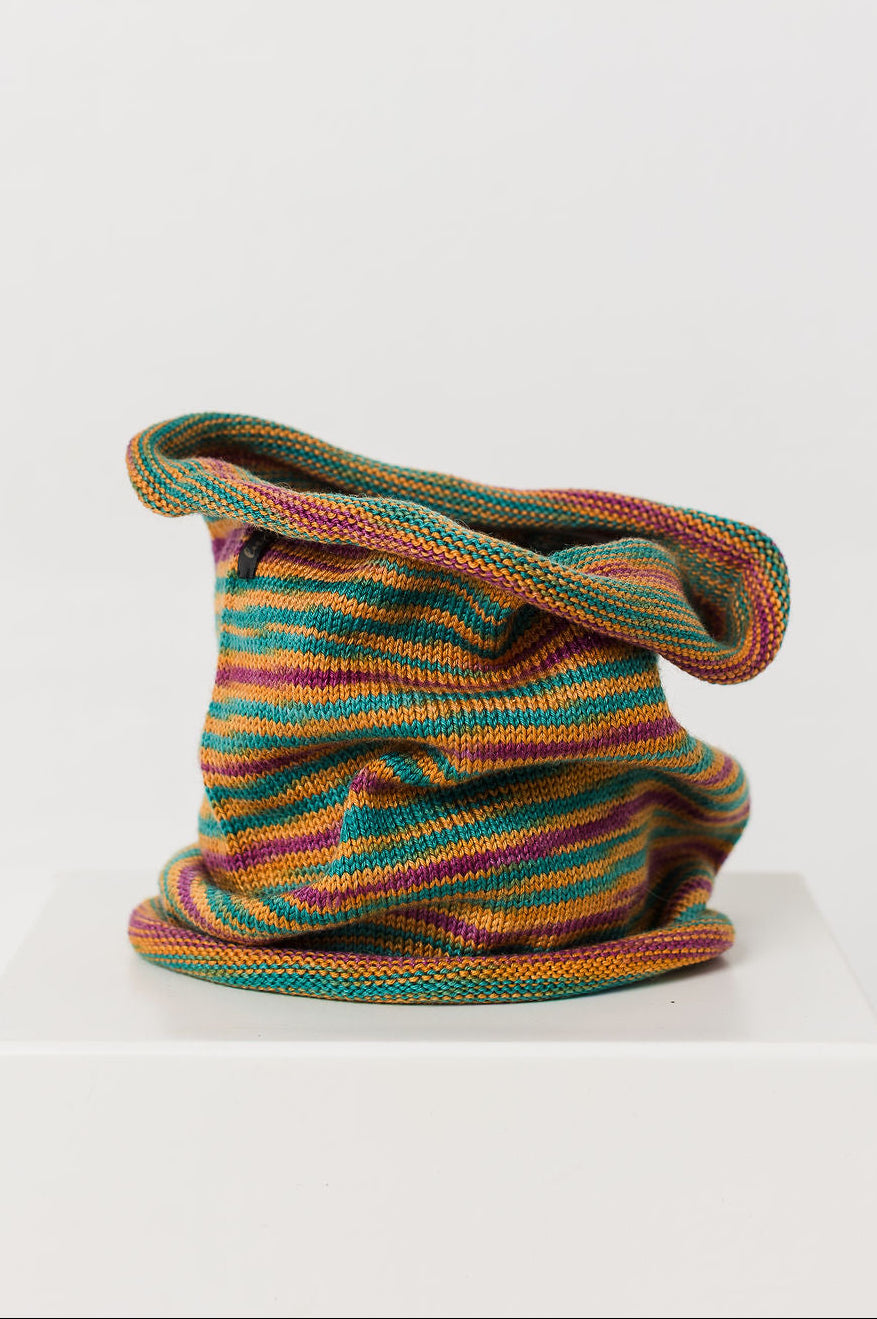 orange green and purple striped neck warmer on white background
